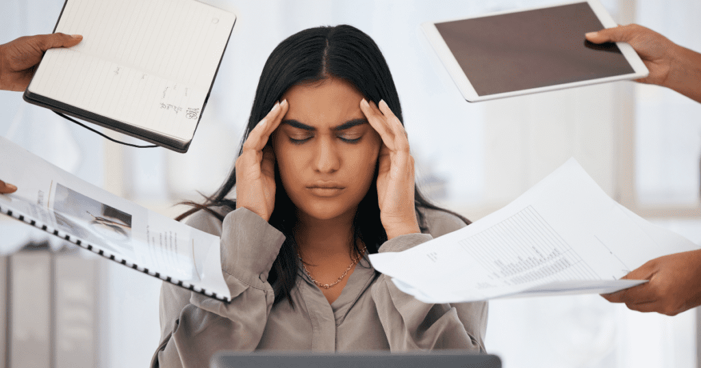 A photo of a frazzled CEO or business owner surrounded by piles of paperwork and a cluttered desk. This image will help readers immediately relate to the feeling of being overwhelmed.